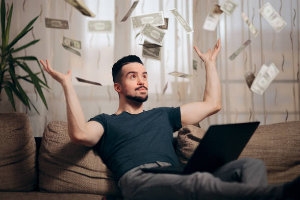 istock Man Making Money from Home on his Laptop 1127248225