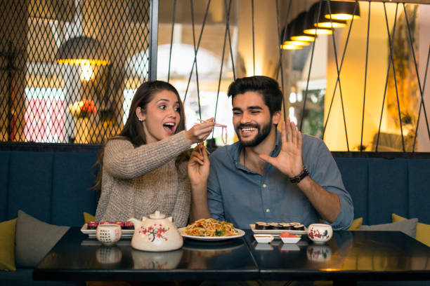 istock Young couple in a Chinese restaurant 1127248988