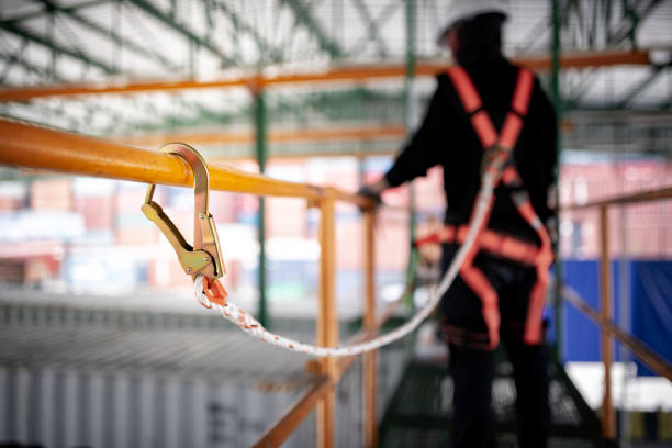 istock Construction worker wearing safety harness and safety line working on construction. 1127249066
