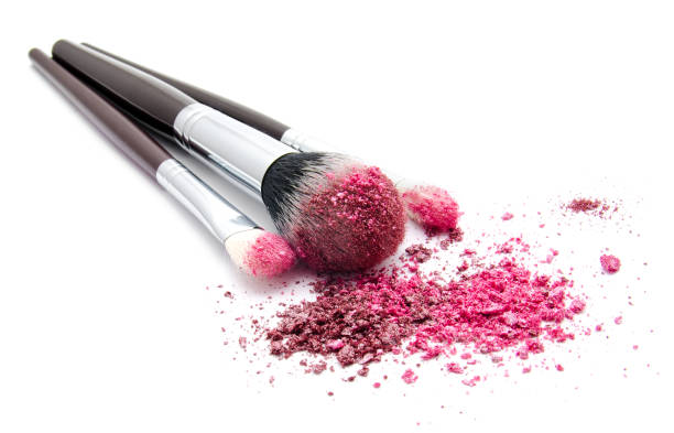 istock Professional makeup brush and colourful eye shadows isolated 1127250092