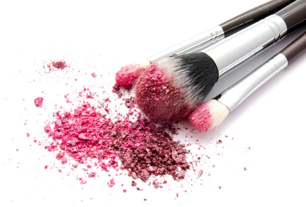 istock Professional makeup brush and colourful eye shadows isolated 1127250095