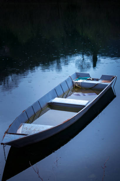 istock Neglected empty wooden fisherman boat 1127250554