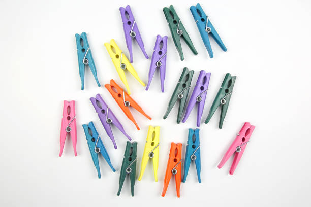 istock Colored clothespins for clothes on a white background 1127254543