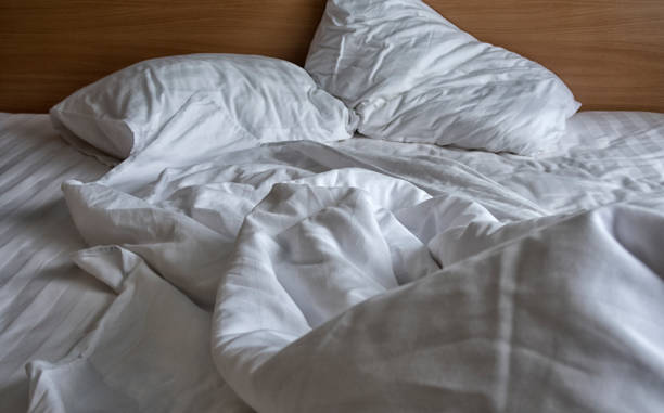 istock comfortable bed in the hotel room, top view. 1127255505