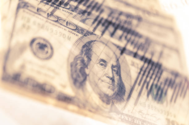 istock Double exposure Stock market display or forex trading graph and candlestick chart on dollar banknote 1127255567