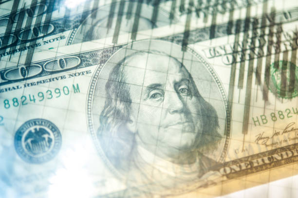 istock Double exposure Stock market display or forex trading graph and candlestick chart on dollar banknote 1127255681