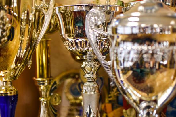 istock Silver and gold sports cups, close-up 1127258437