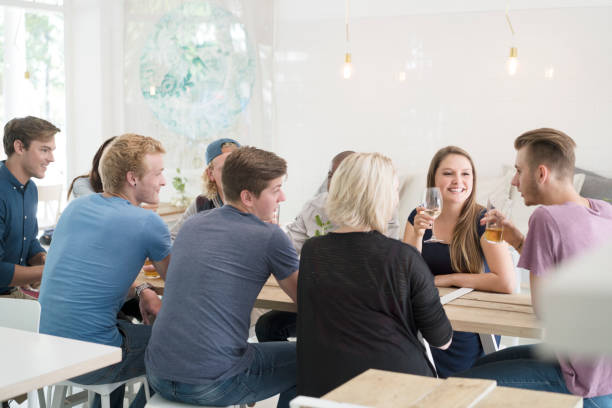 istock Multi-ethnic friends socializing in restaurant 1127259324