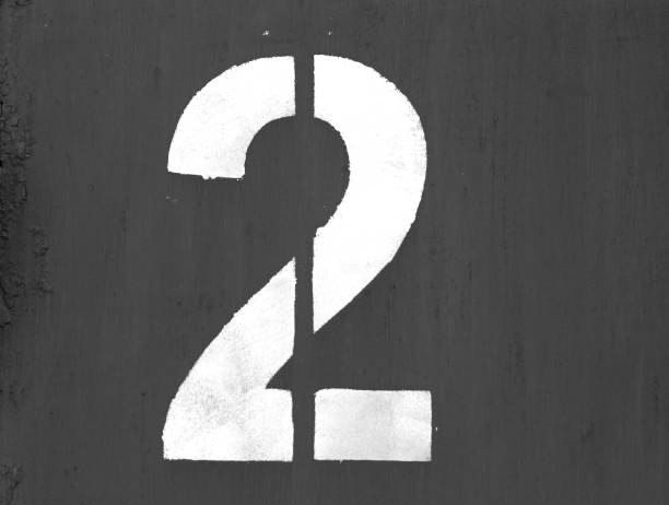 istock Number 2 in stencil on metal wall in black and white. 1127261906