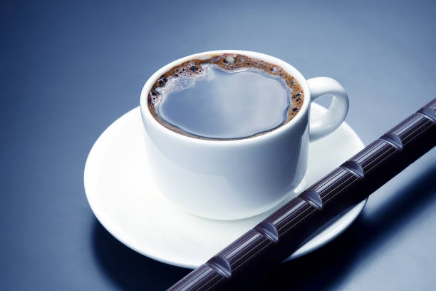 istock white cup with black coffee and chocolate on the saucer 1127262601
