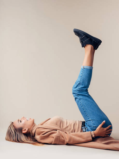 istock Woman is lying down on the floor 1127263099
