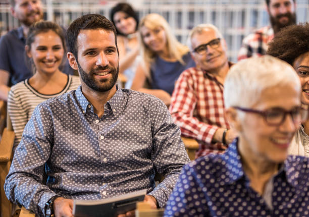 istock Crowd of happy freelancers attending a professional training class in board room. 1127263277
