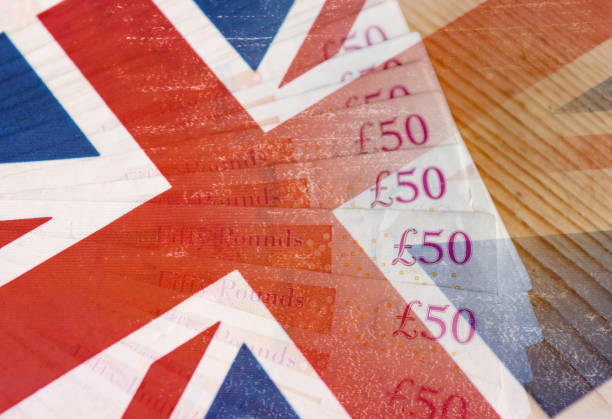istock UK flag and fifty pound notes 1127264493