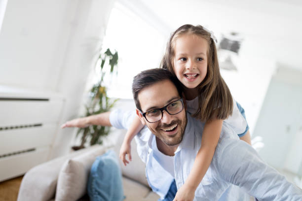 istock Happy family having fun time at home 1127265273