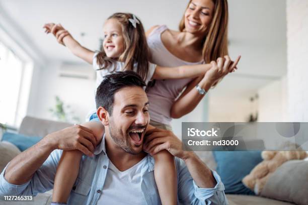 Happy Family Having Fun Time At Home Stock Photo - Download Image Now - Family, Happiness, Domestic Life