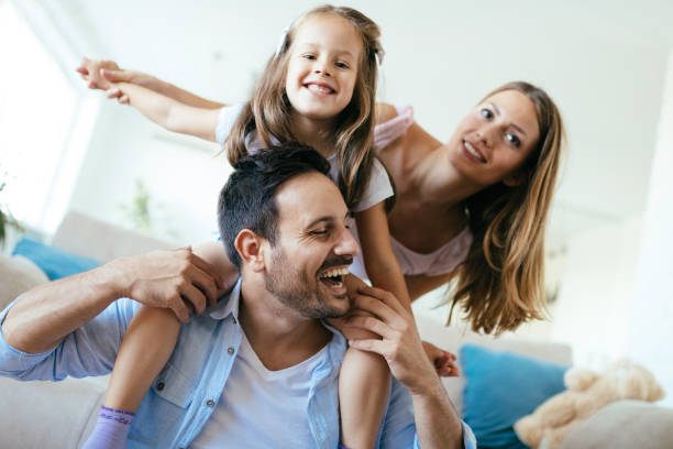 istock Happy family having fun time at home 1127265318