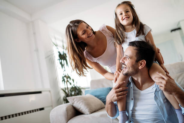 istock Happy family having fun time at home 1127265322