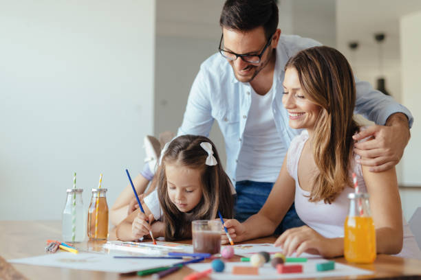 istock Happy family having fun time at home 1127265364