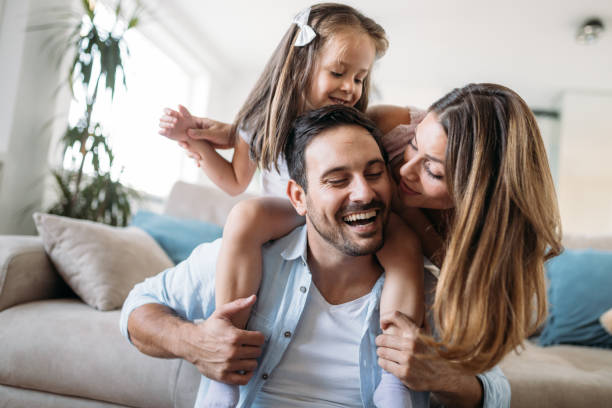 istock Happy family having fun time at home 1127265464