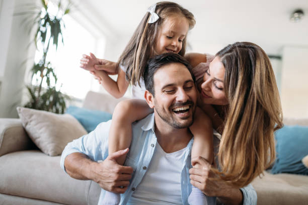 Happy family having fun time at home Happy family having fun time together at home serbia photos stock pictures, royalty-free photos & images