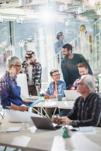 istock Team of happy freelancers cooperating while working in the office. 1127265631