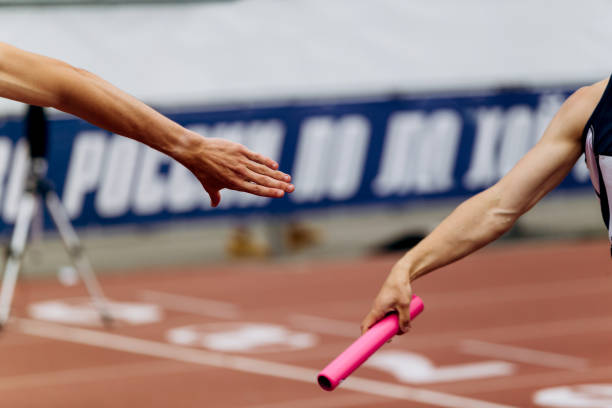 istock relay race racing hands men runners 1127265700