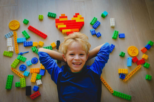 cute little boy love playing with plastic blocks, education and learningcute little boy love playing with plastic blocks, education and learning