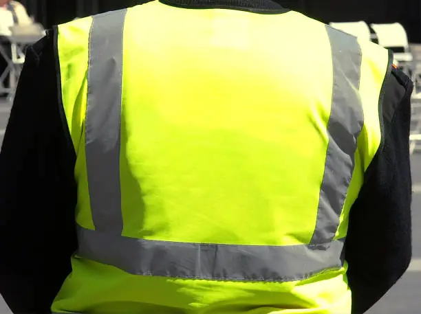 Photo of unrecognisable yellow vest person