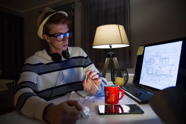 istock Male mid age man architect working at home 1127267164