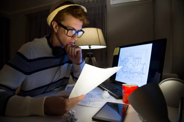 istock Male mid age man architect working at home 1127267236