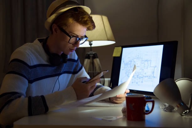 istock Male mid age man architect working at home 1127267269