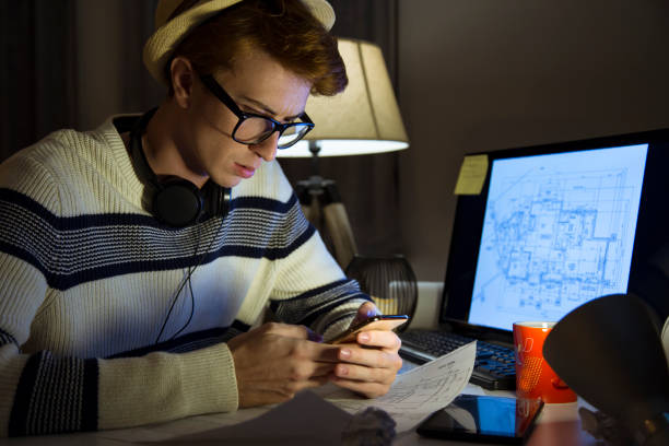 istock Male mid age man architect working at home 1127267301
