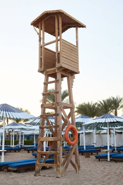istock Wooden lifeguard tower on the sand beach 1127272577
