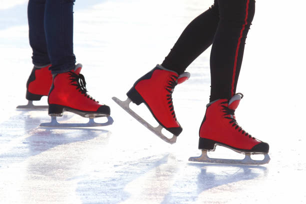 istock feet in red skates on an ice rink 1127274558