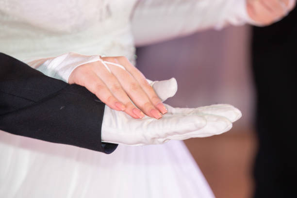 Wedding theme, holding hands newlyweds White gloves