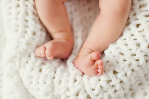 istock cute baby feet 1127277381