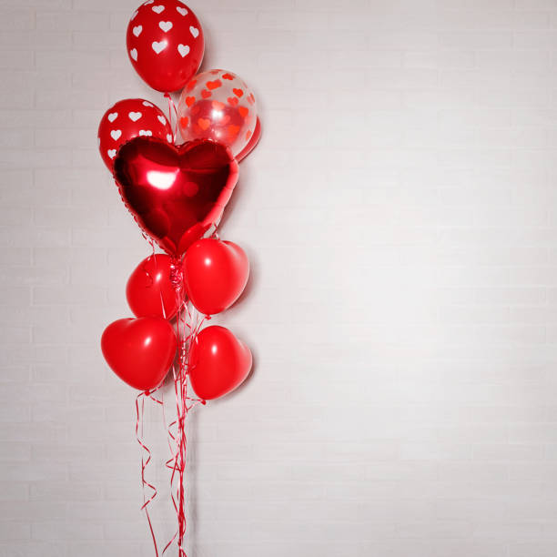 istock Bunch of red heart shaped baloons 1127280003