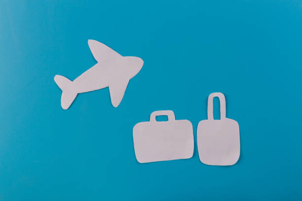 istock Suitcase at the beach. airplane 1127282401