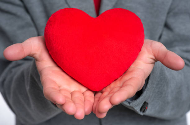 istock Teen boy with red heart 1127285674
