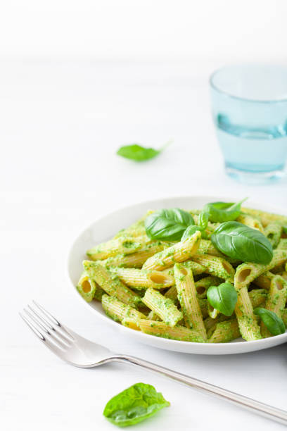 istock penne pasta with spinach basil pesto sauce 1127287035