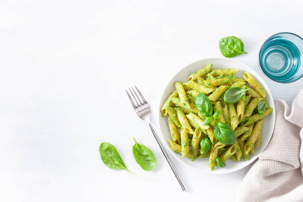 istock penne pasta with spinach basil pesto sauce 1127287098
