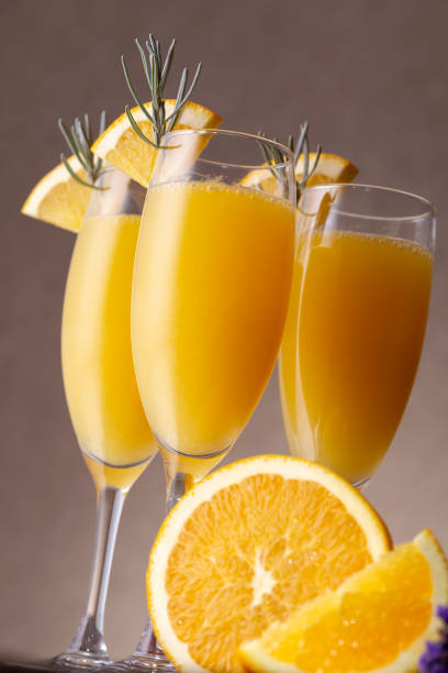 istock Mimosa cocktails in champagne glasses 1127287314