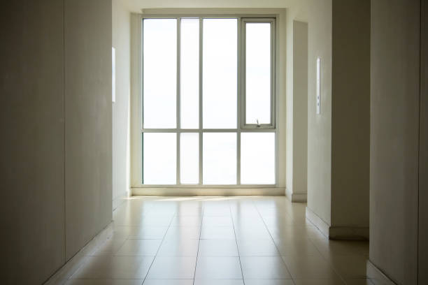 istock image of windows in modern office building.empty long corridor in the modern office building. 1127289861