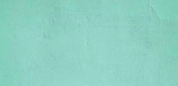 Photo of Grunge Decorative Light Green plaster Wall Texture.