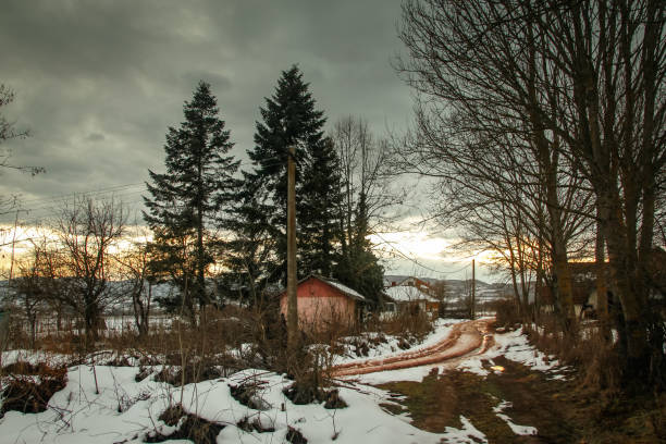 istock Winter rural scene at sunset with bits of snow 1127292421