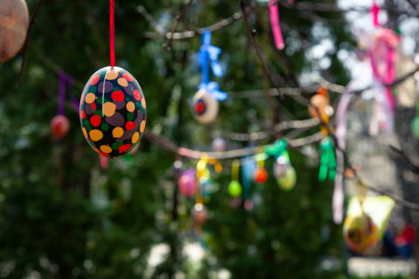 istock Happy Easter card. Colorful handmade Easter eggs decorated city streets and parks. 1127293937