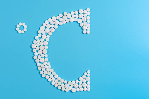 istock Symbol of Celsius is laid out with a white pill on a blue background 1127293947