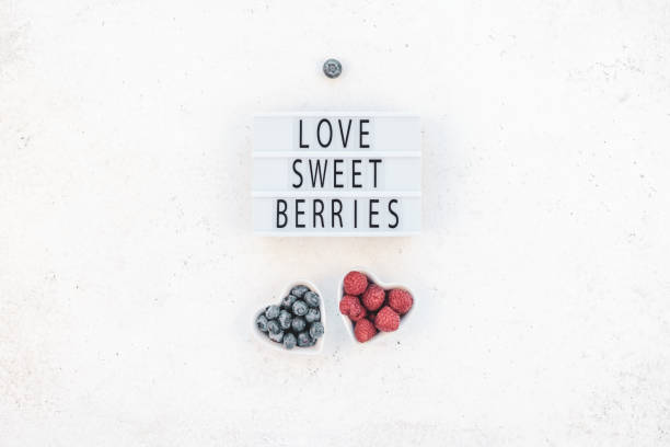 istock Valentine Day composition berries in heart plates 1127295979