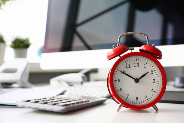 istock Red alarm clock set at eight in the morning closeup 1127296501