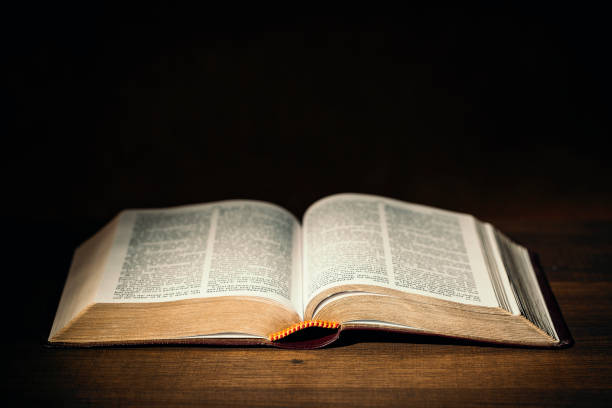 istock Holy Bible in the dark on a pastor's desk 1127297687